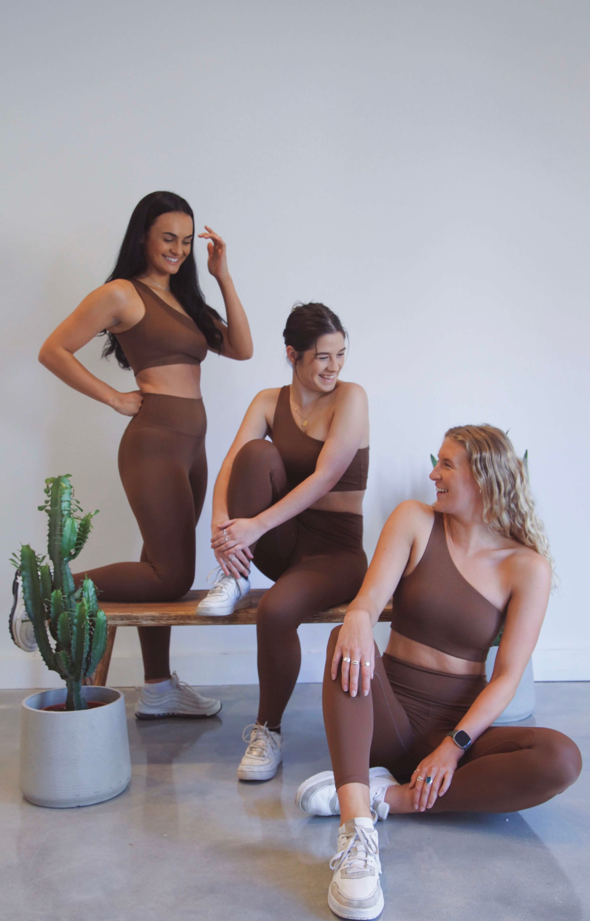 group shot of girls in matching brown yoga set, eco friendly